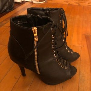 Black heels with gold zipper.This is from wet seal